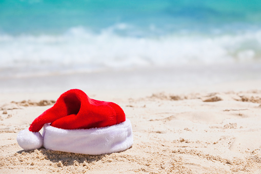Santa hat on the beach in the Bahamas with copy space.