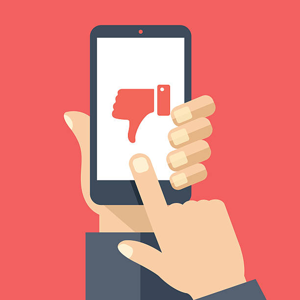 Hand holding smartphone, dislike on screen. Flat design vector illustration Hand holding smartphone with red dislike on screen. Social network and media on mobile phone. Modern graphic elements for web banners, web design, printed materials. Flat design vector illustration disgusted stock illustrations