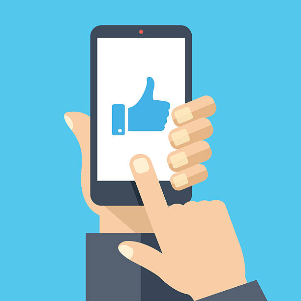 Hand holding smartphone, like on screen. Flat design vector illustration Hand holding smartphone with blue like on screen. Social network and media on mobile phone. Modern graphic elements for web banners, web design, printed materials. Flat design vector illustration social media icons phone stock illustrations