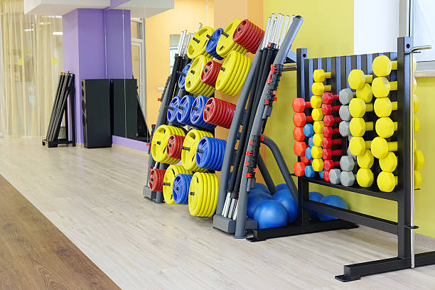 istock fitness hall with dumbbells 607761512