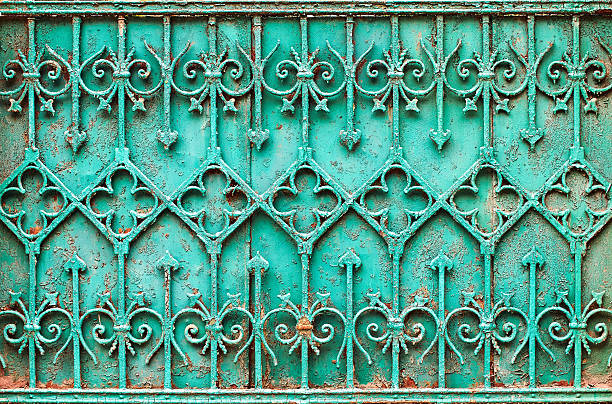 istock Vintage turquoise wrought iron fence 607763302