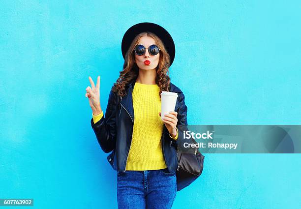 Fashion Pretty Woman With Coffee Cup Wearing Black Rock Style Stock Photo - Download Image Now