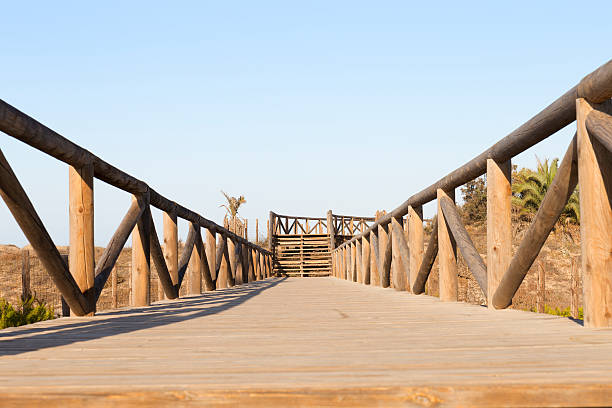 istock foot bridge with wooden fences 607764262