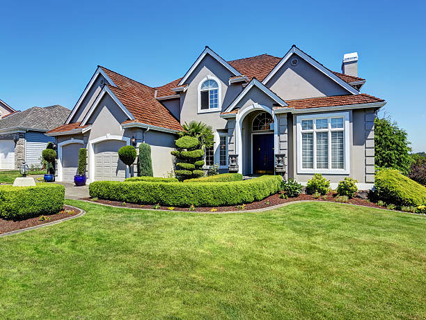 istock Luxury residential house with perfectly kept front garden. 607764424
