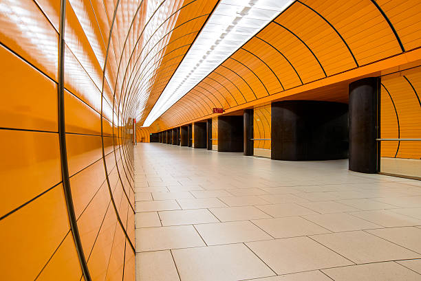 istock Orange pedestrian tunnel in Munich 607764536