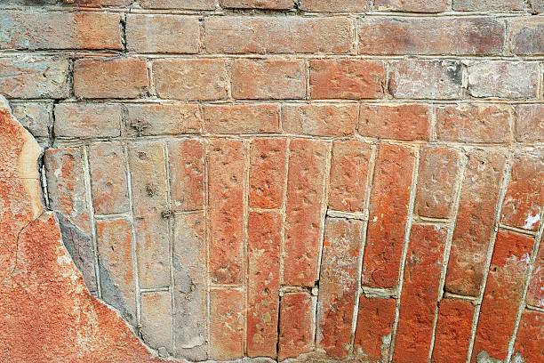 istock Old cracked concrete vintage circular masonry brick wall background, Texture 607764834