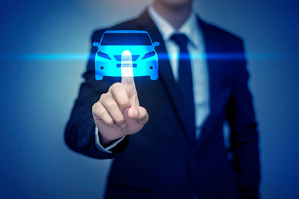 istock Close up of businessman touching car icon on virtual screen 607765310