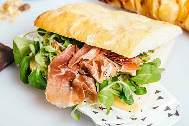 istock Ham and green salad sandwich breakfast 607765944
