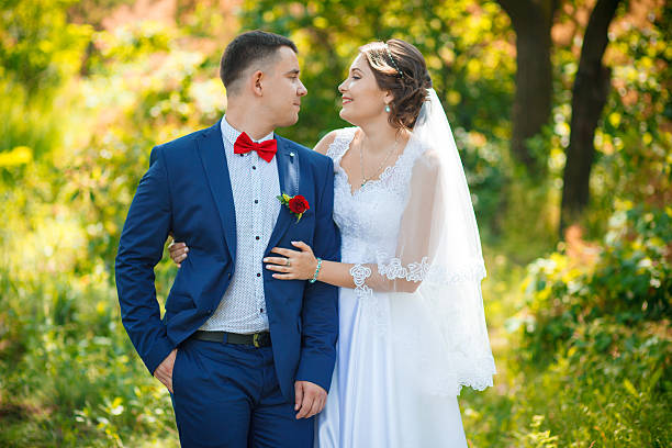 istock Lovely wedding couple kissing 607766338