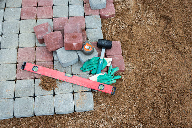 istock stone blocks rubber hammer level gloves and tape measure 607767522