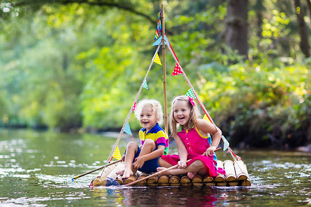 istock Kids on wooden raft 607767604