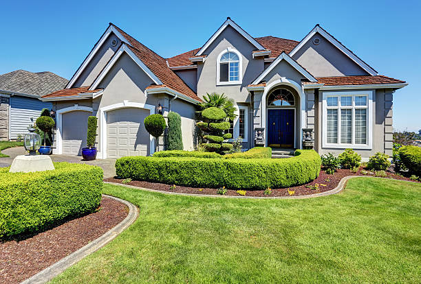 istock Luxury residential house with perfectly kept front garden. 607767746