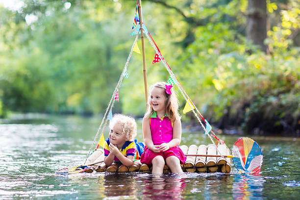istock Two kids on wooden raft 607768964
