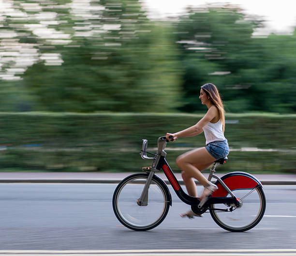istock Woman riding a bike 607770164