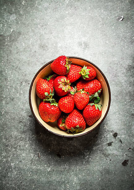 istock Ripe strawberries in a bowl. 607771290
