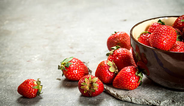 istock Ripe strawberries in a bowl. 607771364