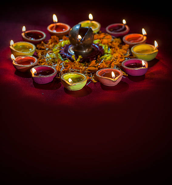 istock Clay diya lamps lit during Diwali Celebration. Greetings Card Design 607773738