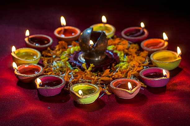 istock Clay diya lamps lit during Diwali Celebration. Greetings Card Design 607774118