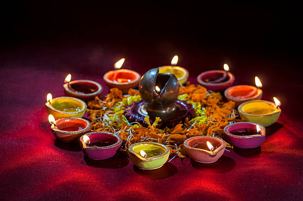 istock Clay diya lamps lit during Diwali Celebration. Greetings Card Design 607775162