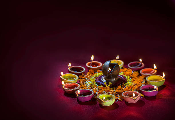 istock Clay diya lamps lit during Diwali Celebration. Greetings Card Design 607775310