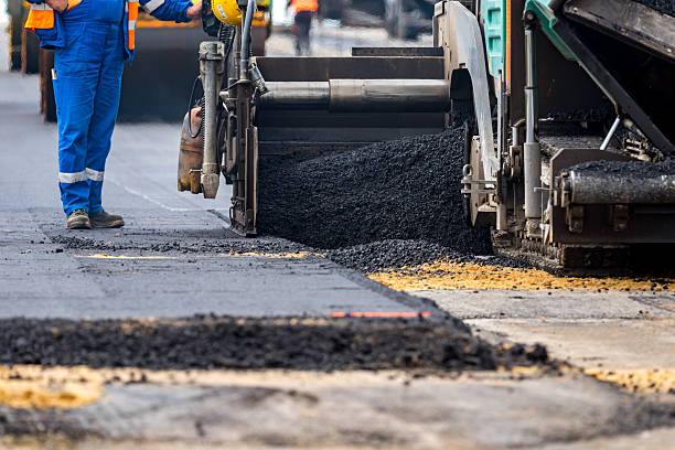 istock The workers and the asphalting machines 607775760