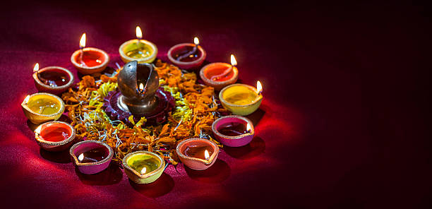 istock Clay diya lamps lit during Diwali Celebration. Greetings Card Design 607776560