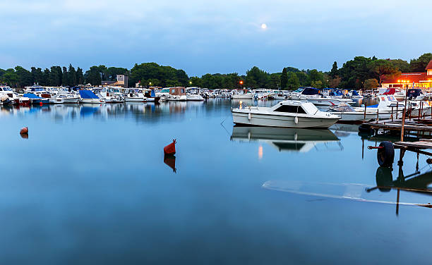 istock Boats moored in port 607777202