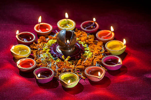 istock Clay diya lamps lit during Diwali Celebration. Greetings Card Design 607777276