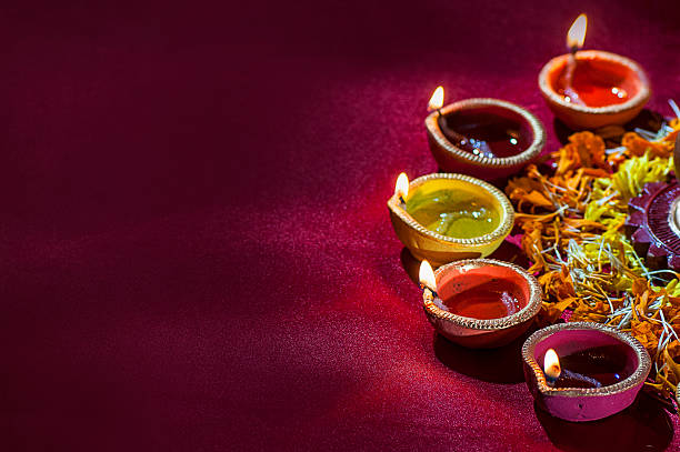 istock Clay diya lamps lit during Diwali Celebration. Greetings Card Design 607777400