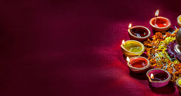Clay diya lamps lit during Diwali Celebration. Greetings Card Design