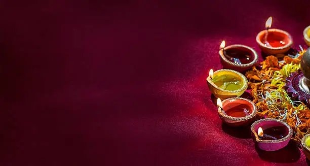 Photo of Clay diya lamps lit during Diwali Celebration. Greetings Card Design