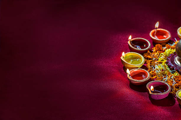 istock Clay diya lamps lit during Diwali Celebration. Greetings Card Design 607777816
