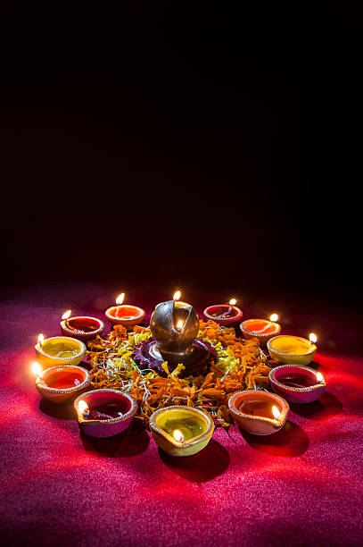 istock Clay diya lamps lit during Diwali Celebration. Greetings Card Design 607872324