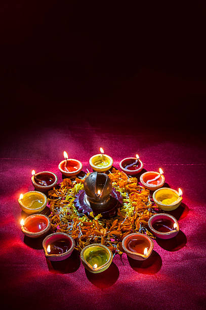 istock Clay diya lamps lit during Diwali Celebration. Greetings Card Design 607872920
