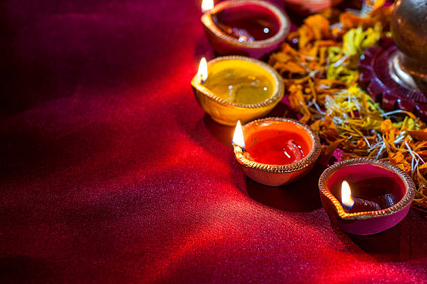istock Clay diya lamps lit during Diwali Celebration. Greetings Card Design 607874708