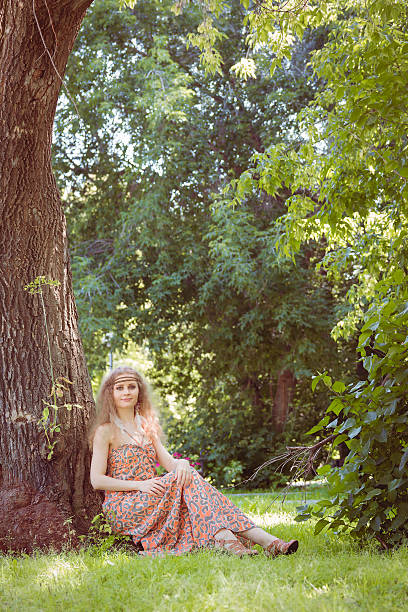 istock Beautiful Boho Girl Sitting 607878562