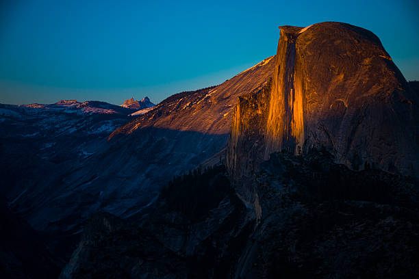 istock National Park Yosemite Half Dome lit by Sunset Light 607880020