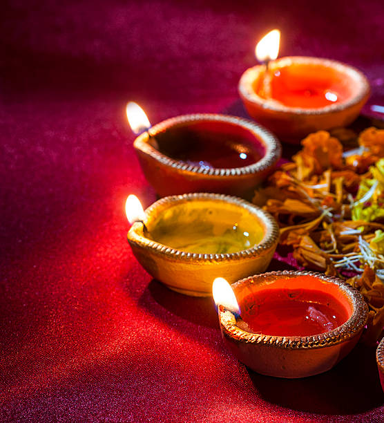 istock Clay diya lamps lit during Diwali Celebration. Greetings Card Design 607880542