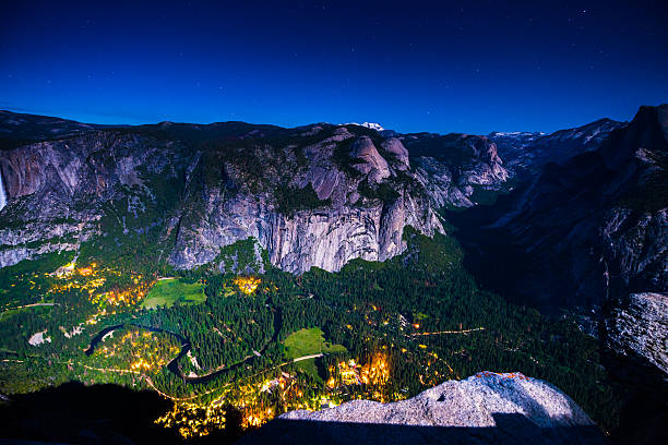 istock Half Dome Village and Falls at Night 607880614