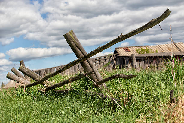 istock old  farm with the house and  field grassed 607881778
