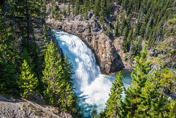 Beautiful falls on rough northern river among an autumn wood
