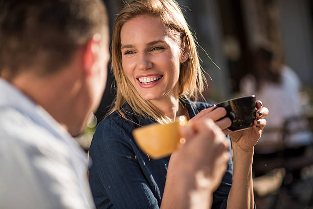 istock Happy couple in cafeteria 607883808
