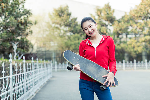 istock girl and her skateboard 607884974