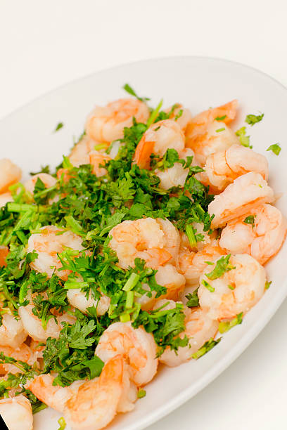 istock Fried shrimps with the greens. 607886706
