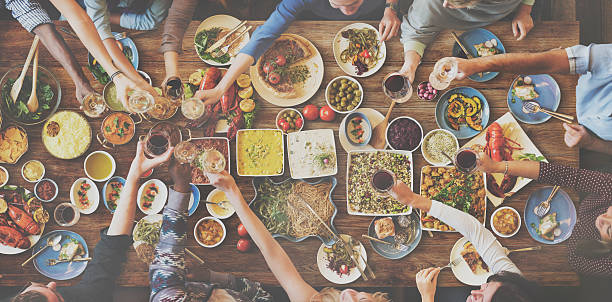 istock Friends Happiness Enjoying Dinning Eating Concept 607887422