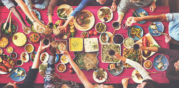 istock Friends Happiness Enjoying Dinning Eating Concept 607887580