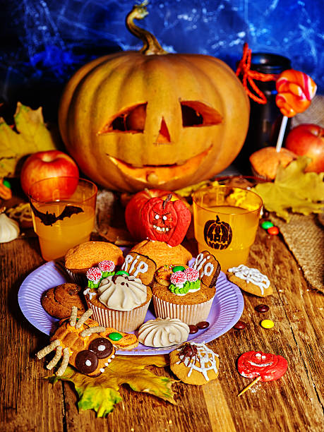 istock Halloween table with trick or treat Jack OLanten pumpkin. 607889796