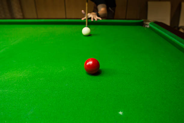 istock Men's hand hold Snooker cue with snooker ball 607890964