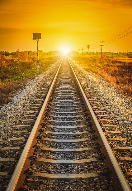 istock Railway Track in a Rural Scene at sunset time. 607891412