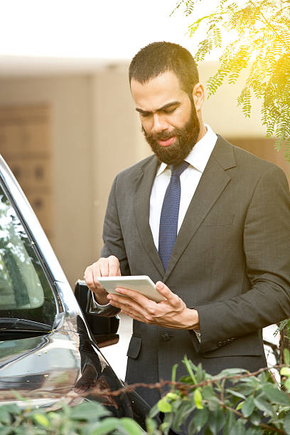 istock Businessman with digital tablet 607893028